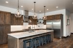 Gorgeous granite counters and stainless steel appliances in the kitchen